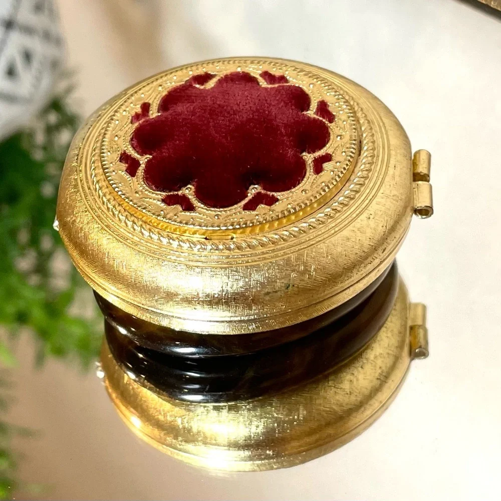 Vintage Revlon “Love Pat” Gold-tone Powder Compact with Burgundy Velvet Accent.